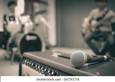Closeup of microphone on musician blurred background