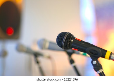 close-up microphone on the stage against colorful background