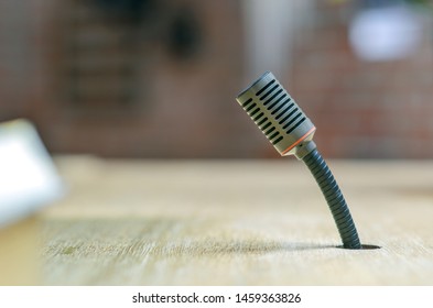 Close-up of a microphone â€“ side view with selective focus and blurred background 
