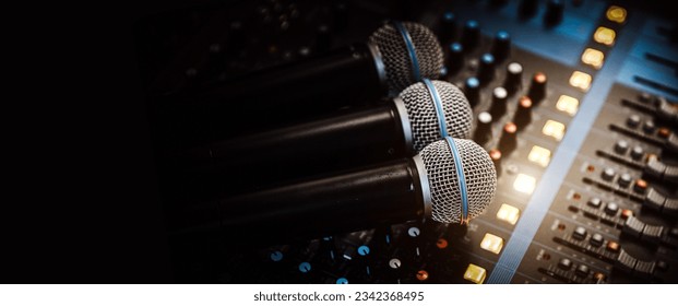 Close-up microphone and sound mixer in studio for sound record control system and audio equipment and music instrument - Shutterstock ID 2342368495