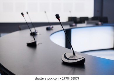 Close-up Of Microphones In An Empty Meeting Room At A Press Conference.