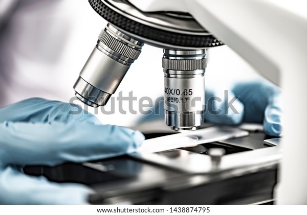 close-up of Microscope lens, science tools\
microscope in\
laboratory