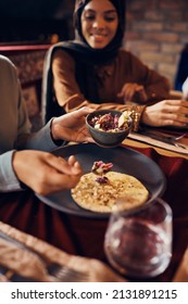 Close-up Of Middle Eastern People Having Ramadan Iftar Meal At Home.