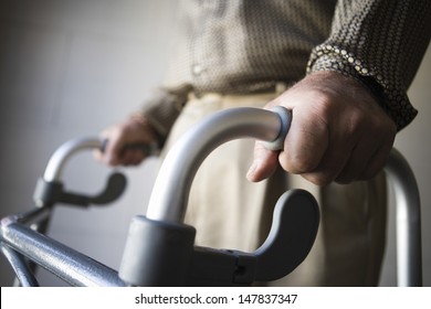 Closeup midsection of a man using walking frame - Powered by Shutterstock