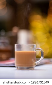 Closeup Of Milk Tea In Transparent Glass Cup On White Table.