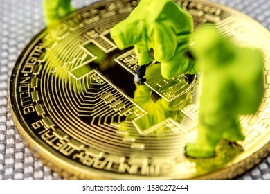 closeup of miniature figurines dressed like members of firemen special team interfering during gas and other chemical accidents with the action protecting/saving bitcoin and the whloe crypto world,