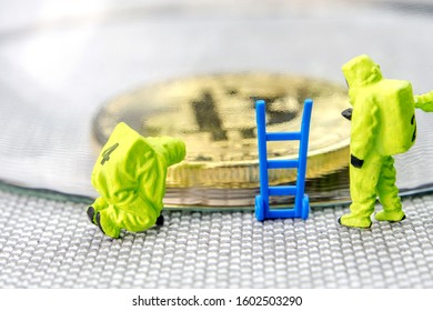 closeup of miniature figurines dressed like members of firemen special team interfering during gas and other chemical accidents with the action protecting/saving bitcoin and crypto world with shield - Powered by Shutterstock - Get 15% off with code: PIKWIZARD15