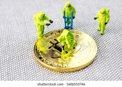 closeup of miniature figurines dressed like members of firemen special team interfering during gas and other chemical accidents with the action protecting/saving bitcoin and the whole crypto world, - Powered by Shutterstock - Get 15% off with code: PIKWIZARD15