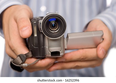 closeup miniDV camcoder in man hands