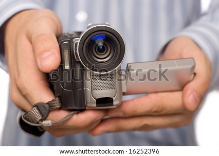 closeup miniDV camcoder in man hands