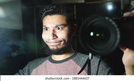 Closeup Mirror Self Portrait Of Young Adult Man Hiding Pain. 