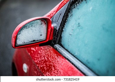 Closeup Mirror And A Window Of A Red Car In Frost