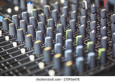 closeup of a mixing soundboard /  mixing soundboard
