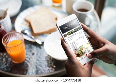 Closeup of mobile phone showing recipe on the screen