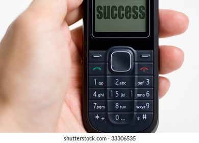 Closeup of a mobile phone with word success - Shutterstock ID 33306535