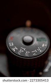 closeup of a mode dial of a digital camera