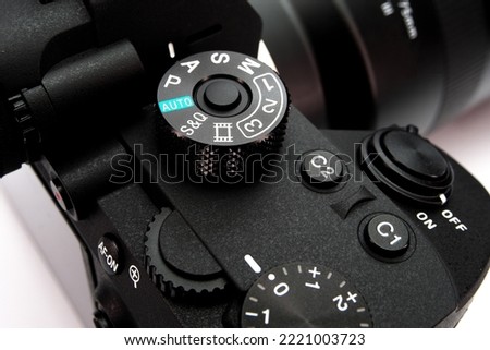 Close-up of the mode dial of a digital camera. Selective focus.