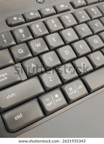 Close-up of a modern computer keyboard with Mac and Windows key labels, suitable for tech, work, or productivity themes.
