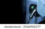 Close-up modern EV Car recharging battery from EV charging machine on black color background, EV Car are a popular new innovation and zero-emission vehicle, green energy for smart life, copy space