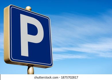 Closeup of a modern Free Parking Sign Road Sign on blue sky with clouds and copy space. Photography.
