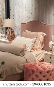 Close-up Of Modern Kids Bed In Pink Tones With Decorative Pillows And Plush Headboard In The Girls Bedroom In Model Of House Or Apartment