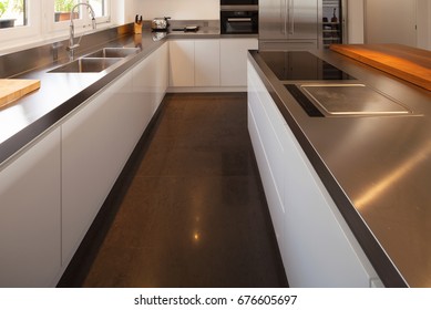 Closeup modern kitchen in luxury flat. Nobody inside - Shutterstock ID 676605697