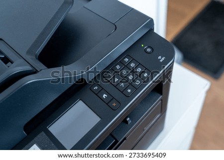 Closeup of Modern Laser Printer Control Panel with Numeric Keypad and LCD Display