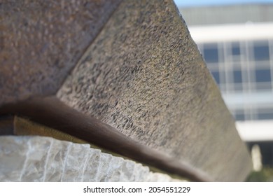 Close-up Modern Metal Sculpture With Stone  And A Background