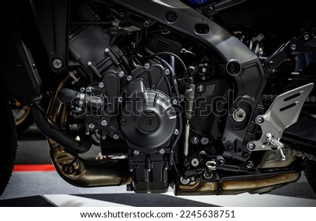 Closeup of modern motorcycle engine and structure. Shiny chrome new motorcycle engine block.