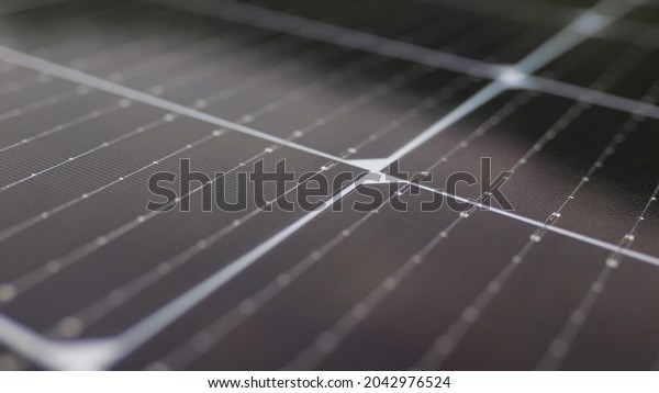 Close-up of modern photovoltaic solar battery panels.\
Solar panel, photovoltaic, alternative electricity source.\
Efficient ecological solar farm. Photovoltaic solar panel extreme\
close up.