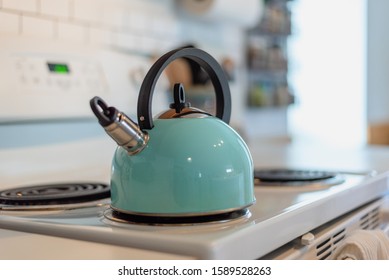 Closeup Of A Modern Tea Pot On Stove Top