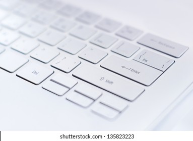 Closeup of a modern ultra thin keyboard with a big return key