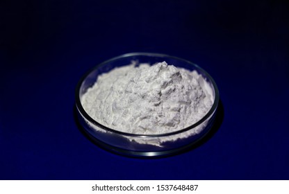 Closeup Of Modified Starch In Chemical Glassware Isolated On Blue Background