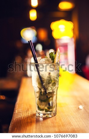 Close-up mojito cocktail in bar