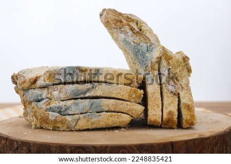 Close-up of Moldy bread on cutting board
