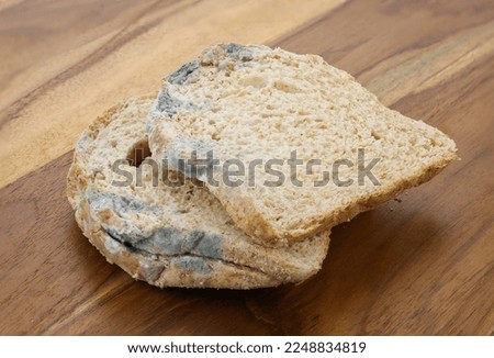 Close-up of Moldy bread on wooden table