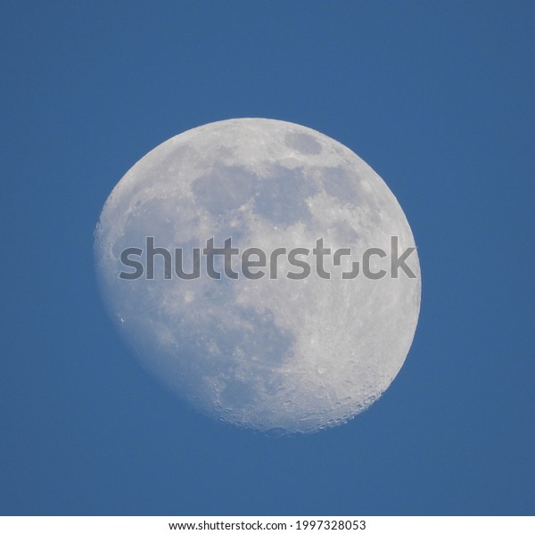 closeup of moon with blue sky as background in
summer 2021