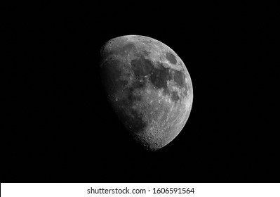 Close-up moon in waxing gibbous phase. Moon surface, craters and the night sky. Isolated on a black background and copy space. - Powered by Shutterstock