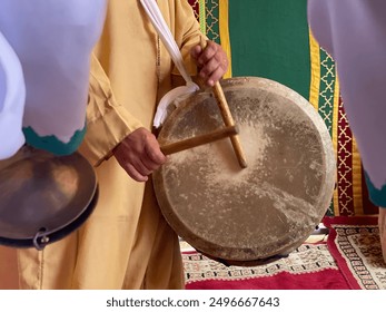 Close-up of moroccan musicians performing traditional folk music, musical instrument  of Gnawa.  - Powered by Shutterstock