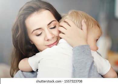 Close-up Mother Hugs Son, Feelings, Relationship Of Mother And Child, Mom Kiss Her Baby