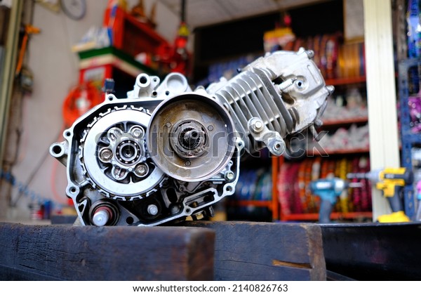 Close-up of\
motorcycle engine repair\
maintenance.