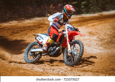Close-up of mountain motocross race in dirt track in day time. Concept focus of during an acceleration in action sport