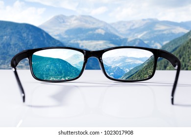 Close-up Of Mountains Seen Through Glasses On Sunny Day