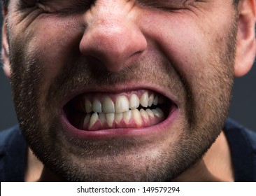 Closeup of mouth of very stressed man