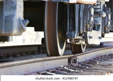 Closeup of the moving train and the railroad