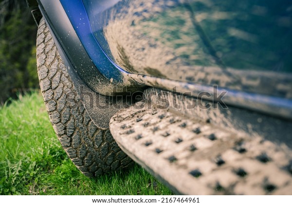 Close-up of a muddy wheel. Big tire of an off-road
vehicle with mud. Splatters of mud on the side of the pick-up.
Adventure, outdoor, 4x4, extreme, travel, mountain excursion
concept. Vehicle off
road