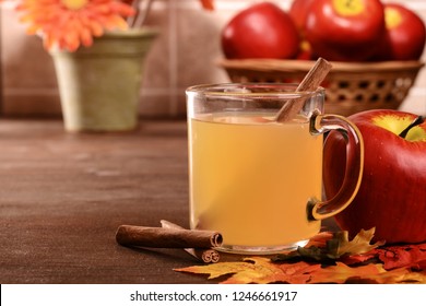 Closeup Mug Of Apple Cider With Cinnamon Stick