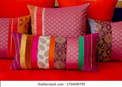 Close-Up Of Multi Colored Cushions On Sofa At Home 