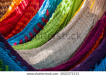 Close-up of multi-colored hammocks, open air market in India