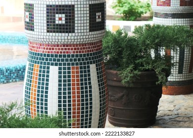 Close-up of a multicolored mosaic tile column. Backyard exterior - Powered by Shutterstock